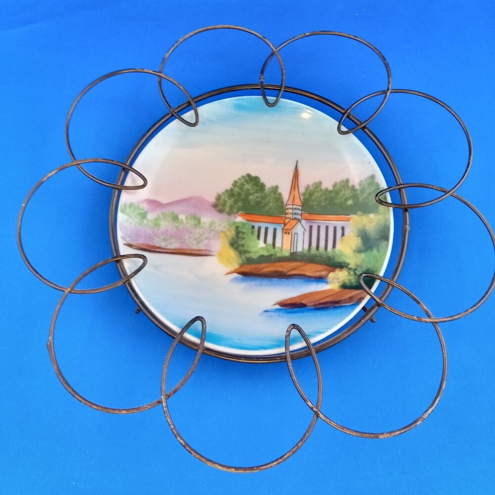 Vintage mid century hand painted plate in black metal daisy frame holder